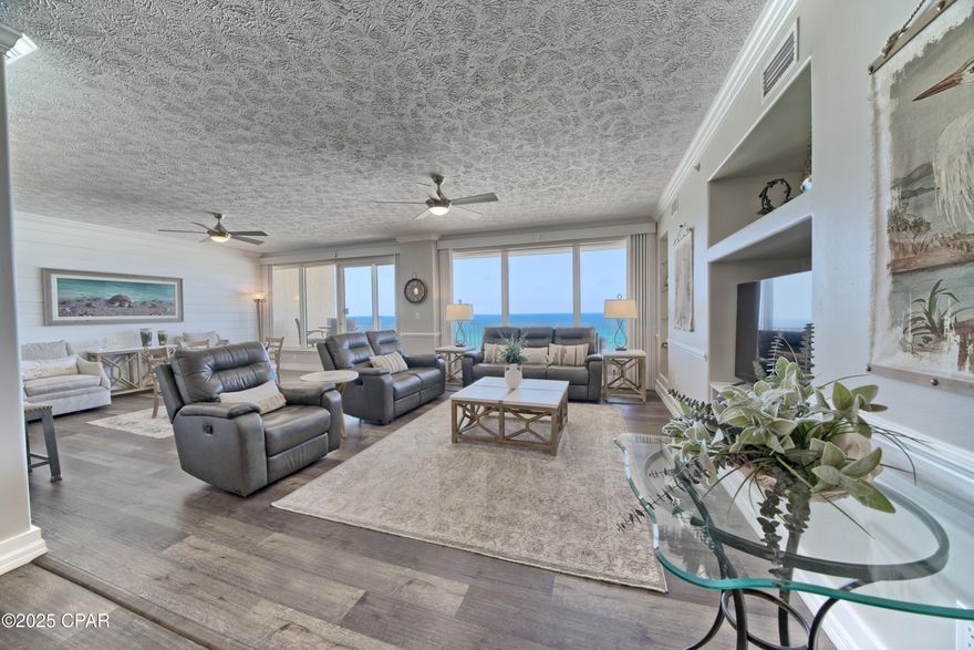 'CURRENTLY UNDER CONTRACT, SELLER WILL CONSIDER BACKUP OFFERS' ***ABSOLUTELY GORGEOUS!!!!**** This 3 bedroom 3 bath condo with a GULF FRONT MASTER BEDROOM boasts over 2300 sq. ft of LUXURY LIVING space and has been BEAUTIFULLY RENOVATED to meet the upscale taste of the owners. Renovations include recently painted, new baseboards throughout, luxury vinyl plank flooring in the main living area, master bedroom, kitchen and bathrooms, new light fixtures, ceiling fans and the list goes on and on!! The gourmet kitchen has custom cabinetry, quartz counter tops, S/S appliances, a new sink, plumbing hardware, recessed overhead and  breakfast bar pendant lighting.  The master bathroom has a custom walk-in shower, separate tub, new double sink vanity with granite counter tops and a HUGE WALK-IN CLOSET!!!.  The furniture has been BEAUTIFULLY updated including custom window coverings throughout. The HVAC and hot water heaters were both replaced in 2024. In addition, the condo has a PRIVATE STORAGE LOCKER which is conveniently located right outside the front door!!.. THIS CONDO IS AN ABSOLUTE MUST SEE!!!. The PRESTIGIOUS HIDDEN DUNES COMMUNITY is located on the HIGHLY DESIRABLE east end on PCB, close to the State Park, marinas, shopping, dining and the BEST PCB has to offer. Don't let this ONCE IN A LIFETIME opportunity pass you by!!