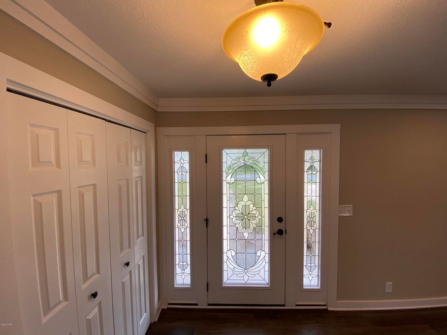 Completely Remodeled Brick Canal Front home with deep water access and a private boat launch, seawall and boat house on large corner lot. This home has undergone a extensive remodel and modernization that went far beyond just repair some hurricane damage.  The entire floor plan has been reworked to include new interior finishes, fixtures,  vinyl plank and upgraded carpet flooring,  walls, roof, appliances, vanities, all topped with the finest granite. Very large yard with boat house and deck over looking canal. There is a private boat launch directly from back yard into the canal. Master Bedroom is awesome. Huge walking closet with shelving and organizers. Awesome Home. Bring your Boat and move in! Owner will consider leasing for $2950 per month.