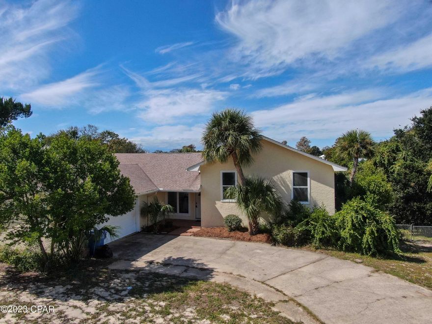 This home presents a plethora of exciting possibilities for those seeking a versatile and convenient living experience. 

One standout feature is the absence of a Homeowners Association (HOA), granting you the freedom to personalize your space and the peace of mind that comes with avoiding HOA fees and restrictions.

Beyond that, the property offers a generous, spacious lot. Whether you have a boat, a trailer, or frequently host friends and family, you'll never have to fret about street parking. 

The ample room provides the perfect canvas for outdoor activities, ensuring your home is a welcoming gathering spot.

Inside, the multi-level design is a highlight. The lower level serves as a flexible space that can cater to a variety of needs. Whether you envision it as a comfortable mother-in-law suite, a man cave for relaxing, or an entertainment area for lively parties, this home provides the perfect canvas for your lifestyle.

But the advantages don't end at the property line. The location is truly ideal. With the airport a mere 15-minute drive away, you can travel with ease. 

Additionally, you're just minutes from the bustling hub of Pier Park, where shopping and entertainment opportunities abound. 

What's more, you're within walking distance of the beach, a conservation park, a dog park, a playground, and a sports complex. This means that whether you're seeking relaxation or recreation, it's all within arm's reach.

In summary, this property offers a unique combination of freedom from HOA restrictions, abundant space, and a prime location that will make your everyday life comfortable and enjoyable. It's a true gem that provides a variety of opportunities for homeowners looking to live life to the fullest.
Roof 2018,AC 2017
All Sizes, Dimensions, etc. are approximate. If important, buyer is responsible to verify.