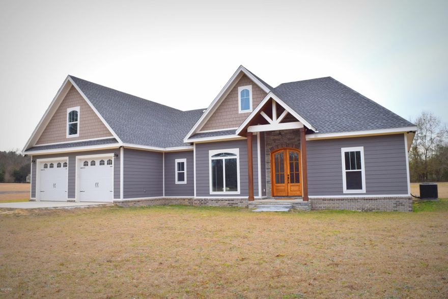 Beautiful craftsman style home nestled on more than 4 acres! This 4 bedroom 3 bath features an open concept with split floor plan, lots of natural light, gorgeous hickory hardwood, brick pavers, spacious living room with cathedral ceiling and electric fireplace. Kitchen boast stainless steel appliances, island with breakfast bar, granite countertops, custom wood vent hood and large pantry with barn door. Master suite includes, trayed ceilings, walk-in tile shower, separate soaking tub, double vanity and massive walk-in closet that is conveniently connected to the laundry room. Outside you will find a 2 car garage, 24x24 pole barn with 12 foot lean-to and fenced back yard. This is a must see!