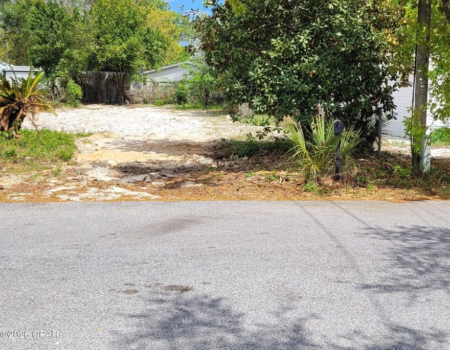 Looking for a large lot to build your dream home and a pool? This large 50 X 128 west end lot is perfect! Recently cleared and ready for your own design. Just blocks to the sugar white sandy beach access. Short term rentals allowed here. All measurements to be verified by the buyer.