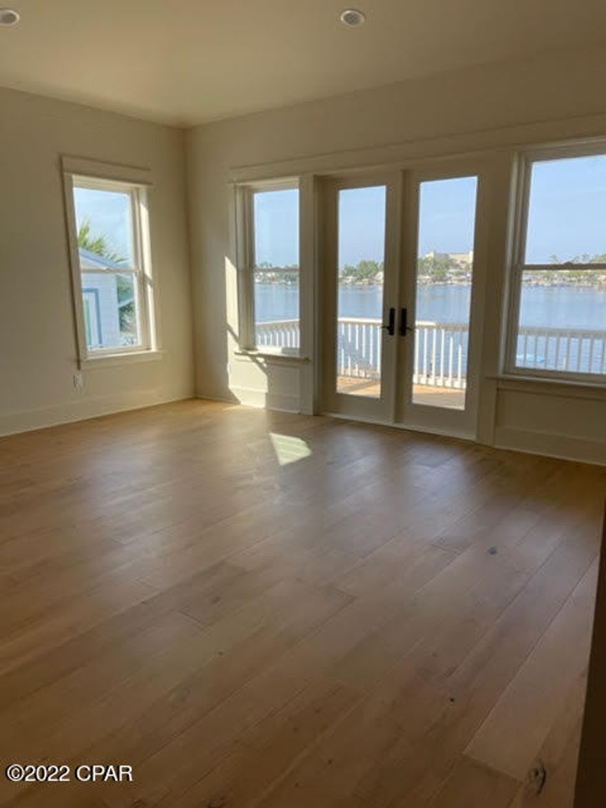 Beautiful Waterfront Home on Grand Lagoon.

New construction 4 Bedrooms and 4.5 baths.

Quartz counter tops, beautifully decorated, downstairs masters, tankless gas hotter heater, hurricane windows and doors, and gas stoves for cooking. All material has been ordered so there will be no changes to the home.House shown is similar but interior finishes will vary. Same decorator with different interior finishes picked out and ordered. For move-in/completion estimates: Ready dates are estimates only. CO and move-in dates may change due to force majeures and other delays outside the reasonable control of the builder. Estimated completion date is August 15, 2022.