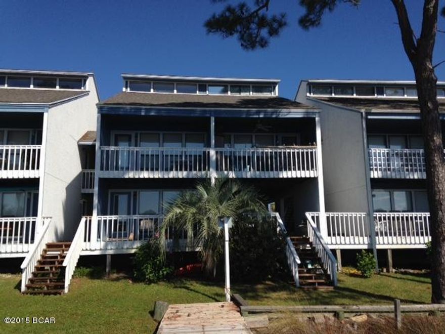 Boat lovers paradise!  Welcome to the perfect spot for your beach getaway!  This lovely lagoon front condo features two private balconies and community dock with your own boat slip!  Enjoy panoramic views of the sunrise and sunset as well as boats coming and going.  Two public boat launches are directly across the lagoon from this condo.  The complex also features a community pool.   This lovely 2 bedroom/2bath unit features vaulted ceilings and skylights, making it feel very open and bright.  This condo is the only one in the complex without a lower unit below.  Don't miss a chance to see this gem!  Sold mostly furnished.  Buyer to verify all dimensions.