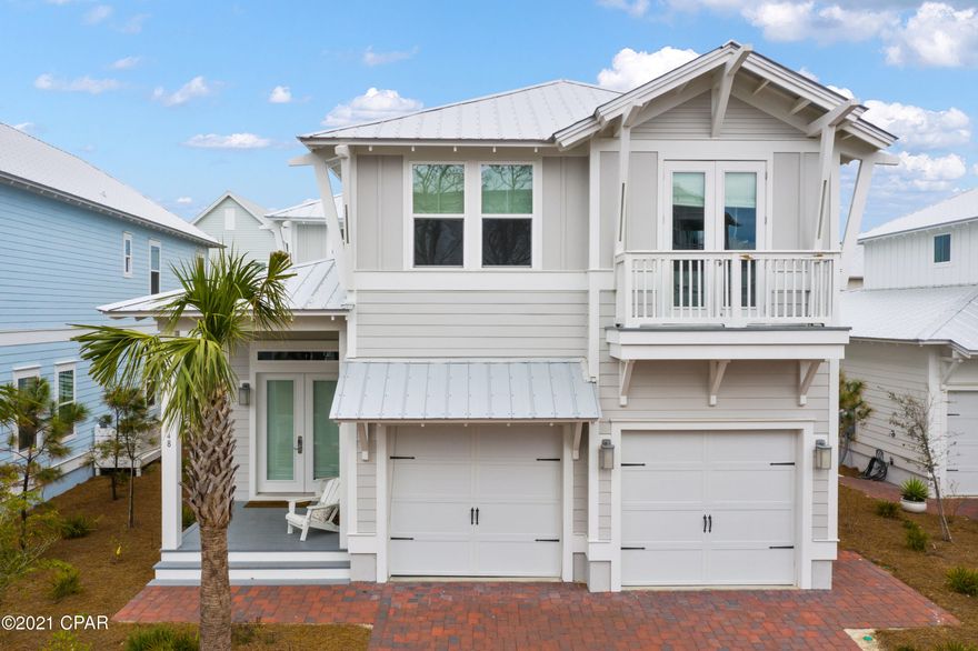 This turn key, professionally decorated two story beach home is the most desired Maui floor plan, within walking distance to the gulf. This immaculate home has it all, oversized covered porches for enjoying summer evenings, there are two garages and with brick paver driveways. This home comes fully furnished and has the features you want in your beach home! Hardwood flooring throughout and tile flooring in the wet areas, 8' doors, smooth finish ceilings and walls, ceilings fans, and surface mount LED lighting. The chef inspired kitchen has maple door cabinetry with soft close doors and under cabinet lighting, built in gas cooktop, single wall convection oven and dishwasher with hidden controls. The countertops are granite with backsplash Stainless double sink, brushed nickel pot filler, Moen faucets and wood shelving throughout. The luxurious bathrooms feature granite throughout and brushed nickel Moen faucets. The Master bath has a frameless glass enclosure with rain shower head on two separate valves and his and hers separate sinks. Smart Home Technology is included with touch panels to allow you to set your AC, control lighting and even secure your home. Exterior features of this home include, oversized covered porches with ceiling fans, professional landscaping, auto garage door openers and an outdoor shower.