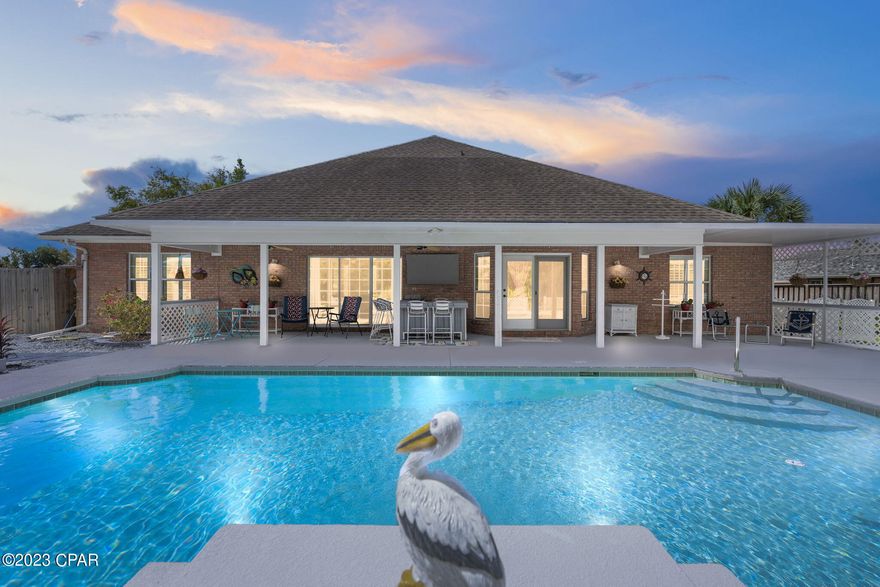 CURRENTLY UNDER CONTRACT, SELLER WILL CONSIDER BACKUP OFFERS.

Welcome to this stunning 3 bedroom, 2 bath home located at the heart of Panama City, FL. In the highly sought after Woods sub-division. Situated on a generous .47-acre lot, this well maintained all-brick residence boasts a spacious 2128 square feet with a finished oversized garage.

Upon entering, you'll be greeted by an inviting living space, with built-in book cases, and adorned with elegant plantation shutters that complement the abundant natural light. The split floor plan seamlessly connects the living room, dining area, and kitchen, making it perfect for entertaining friends and family. 

The kitchen is a chef's dream, featuring beautiful Corian countertops and modern stainless steel appliances. With ample counter space and storage options, this kitchen is both functional and aesthetically pleasing. The master bedroom provides a private oasis, complete with a large ensuite bathroom. The master bathroom includes double sinks, a garden tub, and a walk-in shower with glass enclosure, creating a relaxing retreat for homeowners.

Step outside to discover a backyard paradise. The covered rear patio features a bar area, perfect for outdoor gatherings and enjoying the Florida sunshine. Take a dip in the sparkling inground pool or relax on one of the two raised pool decks, all while being surrounded by the privacy of a fenced backyard. The large storage shed with deck is great for storing all your gardening and recreational equipment.

Convenience is key in this location, with shopping, entertainment, and dining options just minutes away. Gulf Coast Hospital is also a short 5-minute drive from your doorstep.

This home offers all the features and amenities one could desire, without the hassle of an HOA. Don't miss out on the opportunity to own this beautiful property in Panama City, FL. Schedule your showing today and experience the perfect blend of comfort, style, and convenience.