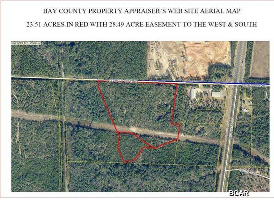 * BANK OWNED FORECLOSURE * THIS 23 ACRES IS LOCATED JUST 800 FEET OFF HWY 231 AND LOCATED ON A PAVED ROAD WITH over 1200 FEET OF PAVED FRONTAGE. (**There is a 29 acre conservation district next to this so no one can ever build on it) The subject consists of a potential 3.45 acre conservation easement on the rear. The remaining 20.06 acres consist of unencumbered uplands. Acreage estimates were taken from the Bay County Property Appraisers Web Site because a current survey on the property was not available. The property is located approximately 800' west of Highway 231 on the south side of County Line Road. The property has a gradual slope from County Line Road to the south. The 20.06 acres are covered with trees and underbrush and appear to be high and dry. There is an estimated 100'  gas line easement that traverses the parcel in an east-west direction. Buyer to confirm all information if important. sold As Is Priced Firm. Buyer pays title seller will only pay Doc Stamps. Taxes are less than $300 a year for the total tract of land.