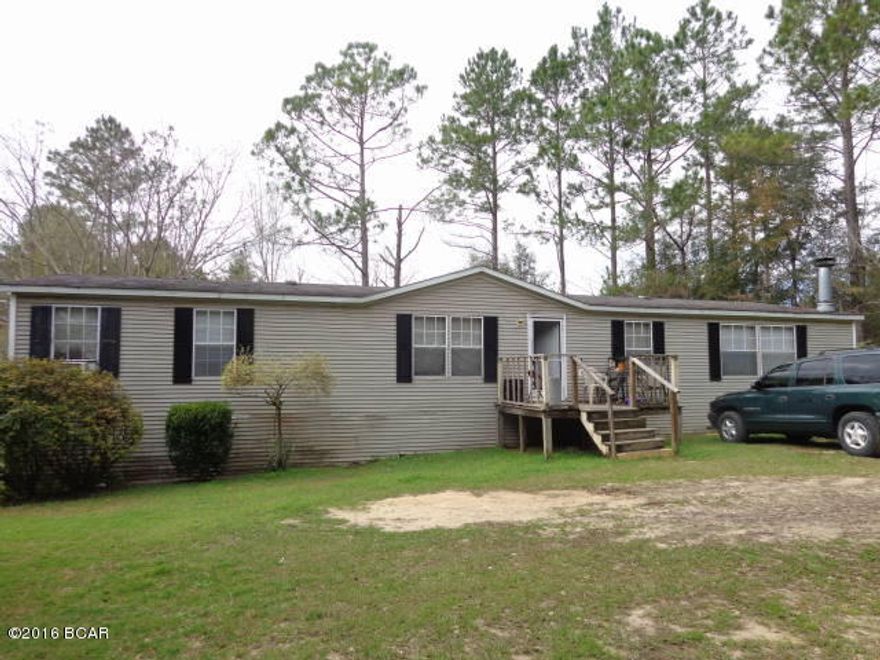 Great Location. Permanently placed Double Wide Mobile Home on a paved road, located just outside of Marianna.  Close to Blue Springs Park for swimming, fishing, and diving. With work could be a great home or investment rental.