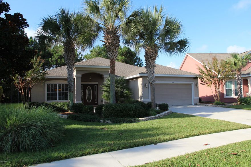 OUTDOOR LIVING AT IT'S FINEST.  This is a beautiful home in Palmetto Trace.  There is over 650 sqft of screened in porch at the back of the home including a beautiful hot tub.  Lots of nature behind this home including a lake.  This is in a quiet part of Palmetto Trace, far removed from Pier Park North.  Inside is special as well, real wood cabinetry, crown molding, solid surface counter tops, master bedroom with access to the outdoor living space.  MAKE SURE YOU COME AND SEE THIS ONE.
