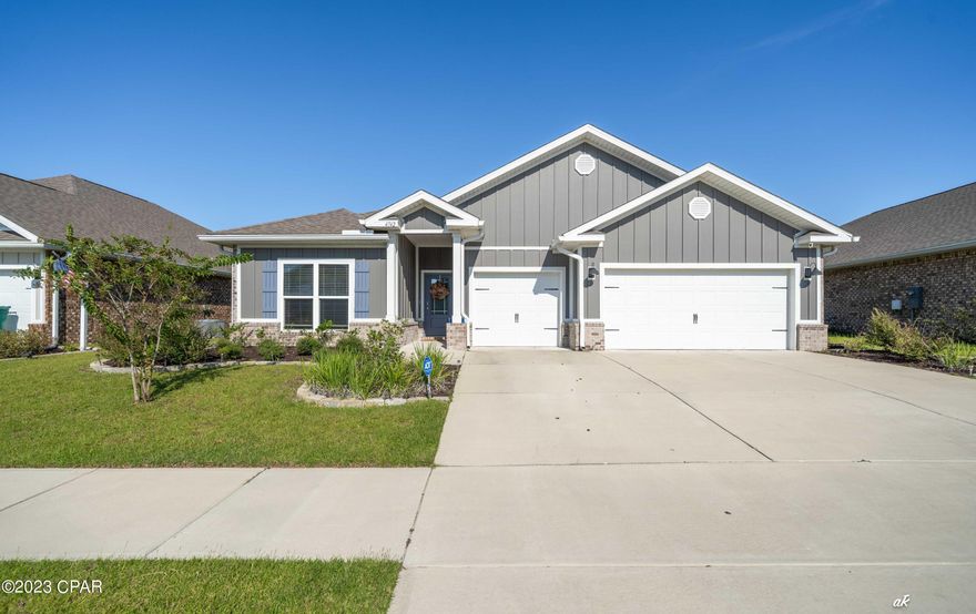 Why wait on new construction? Come check-out this lovely move-in ready full-brick beauty in Titus Park Phase 1. This spacious single-story home has 4 bedrooms, 3 full baths and 1 half bath. Its open floor plan offers formal dining and a generous gathering room, perfect for entertaining. There's also a casual breakfast area included in the open concept kitchen, granite countertops, oversized island that comfortably seats 4, and a contemporary decorative backsplash. The kitchen has plenty of storage with a large corner pantry and ample cabinet space including beneath the Island. This awesome home has 9-foot tray ceilings in the dining room, bonus room, and master bedroom. Luxury vinyl plank flooring throughout, with carpet only in bedrooms, ceiling fans in all bedrooms, gathering room and flex/bonus room. The spacious 3rd and 4th bedrooms share a Jack and Jill bathroom for privacy and plenty of room with a double sink vanity, perfect for guests. 2nd bedroom is a large bedroom with an ensuite bathroom and closet with a large flex/bonus room attached, great for a private office or extended stay for guests to have their own living space. Main bedroom is a luxurious size that could even accommodate a small sitting area, it also has a huge walk-in closet, double sinks in the bathroom, garden tub and separate shower. All appliances are included: stainless steel side by side refrigerator, dishwasher, oven, stove, microwave, LG washer and LG dryer. Upgraded comfort toilets, upgraded interior paint. A full 3 car garage with loads of space for vehicles, golf cart and/or extra storage. Covered and screened lanai, privacy fenced backyard, security cameras, alarm system, water softener, irrigation system and added gutters. All window treatments convey. To top it off, this home comes with an Old Republic home warranty (valid until Jan 2026) which will be transferred to the new owner. Short commute to Tyndall Air Force Base, shopping, restaurants, and schools. Make an appointment to view this amazing home today! You must see it in person to fully appreciate all the wonderful features it offers. 

All measurements are approximate and should be verified by the purchaser.