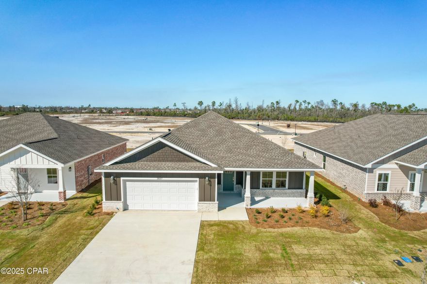 *Ask about special incentives for 5.99% interest rate and additional $3,000 towards closing costs with preferred lender* Welcome to Game Farm! A peaceful, secluded community you'll be proud to call home. Nestled in a central location in Panama City, this charming neighborhood has been thoughtfully crafted by local homebuilder Southern Coastal Homes. From the moment you arrive, a beautifully landscaped grand entrance and scenic bridge welcome you into an inviting environment. This community features wide homesites, three-sided brick homes, preserved natural areas, tranquil ponds, three future parks, and a walking path for residents to enjoy. Inside this home, you'll find a wide range of high-quality upgrades including a tankless gas water heater, 9-foot ceilings, recessed lighting, painted Hardie-board siding on the front exterior, a gas kitchen range, a gas line ready for an outdoor grill, and a fully sodded yard with a sprinkler system. Tray ceilings enhance the living room and master bedroom, while the master bath includes double vanities, walk-in shower with glass door, a large walk-in closet, and convenient access to the laundry room. Additional features include a utility sink in the garage and a practical drop zone as you enter from the garage. This home is filled with beautiful finishes and thoughtful touches offering comfort, style, and everyday functionality. This home is MOVE-IN READY! ACTIVE CONSTRUCTION SITE, please use caution. Buyer to verify any information deemed important.