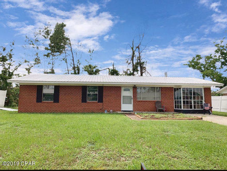 Affordable home in Lynn Haven! HVAC replaced in 2017, hot water heater 2016, updated metal roof. All tile in living and bedrooms and vinyl in the baths. There's a den area with a wood burning stove. This home is energy-efficient with updated appliances and lots of extra blown in insulation. Wired for a whole house generator. Windows are tinted with UV block which keeps the electric bill down and helps prevent hurricane damage. There's a 12 x 24 covered patio in the backyard As well as a small detached storage building.