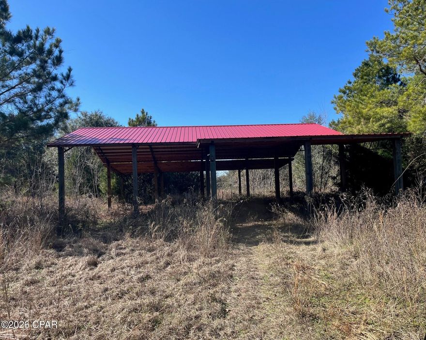 Discover the perfect setting for your dream home on this stunning 10-acre cleared parcel, ready for immediate construction. Dotted with majestic oak trees and surrounded by peaceful natural beauty, this property offers true privacy and tranquility in a highly desirable rural setting.

Already equipped with a well, septic system, and a large pole barn, the groundwork is in place—saving you time and expense as you plan your future homesite. Pole barn is 48'x32' center with 48'x17' lean to on west side and 17'x12' lean to on east side. Approx 30' high at center and 15' at lean to. Unrestricted land means the freedom to bring your animals, create a homestead, or build exactly what you envision.

This is a duck hunter's paradise with the rear of the property over looking a 40+ acre pond known as 'Race Pond'. 

Enjoy the best of both worlds: serene country living just minutes from Lake Seminole, renowned for some of the best fishing in Northwest Florida, and conveniently located approximately one hour from Dothan, Tallahassee, and Panama City.