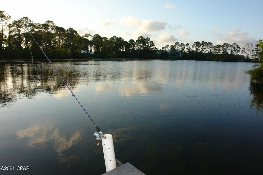 NO HOA! Go fishing, kayaking, canoeing or even paddleboarding in your own back yard! This waterfront home offers 3bd/2ba with a garage on .2 acre lot in the heart of Panama City Beach! This home will not last. Drive your golf cart to the beach, restaurants and shopping! Great primary residence or investment! New Roof in 2019!  Paddle Boats do Convey!

All info approximate and must be verified by buyer.