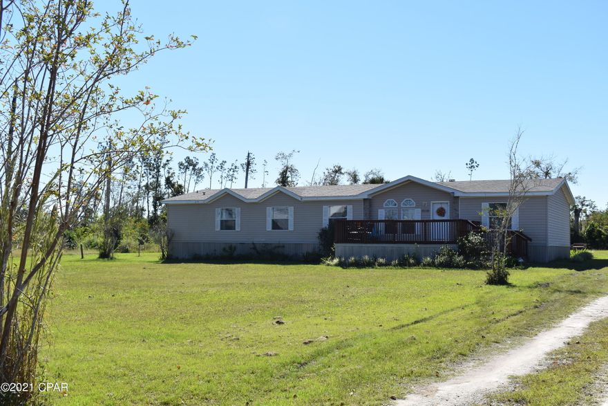 Seller is offering $5,000 towards buyers closing cost with acceptable offer! New home on your Christmas wish list? Take a look at this spacious home over 2000 sg ft, with over an acre of land for privacy! Featuring a warm and inviting wood burning fireplace in the living room (hang your stockings here!! ;), formal dining and open kitchen leading to the large family room. who doesn't want to have family gatherings where everyone can be involved! The split floor plan allows for maximum privacy, master bedroom has a huge walk in closet and luxurious bath with a soaker tub and standup shower, double sinks, at the other end of the home you have 2 more bedrooms plus a bonus room perfect for office, guest bedroom. Centrally  located minutes to shopping, Tyndall AFB or 25 minutes to sandy beaches!