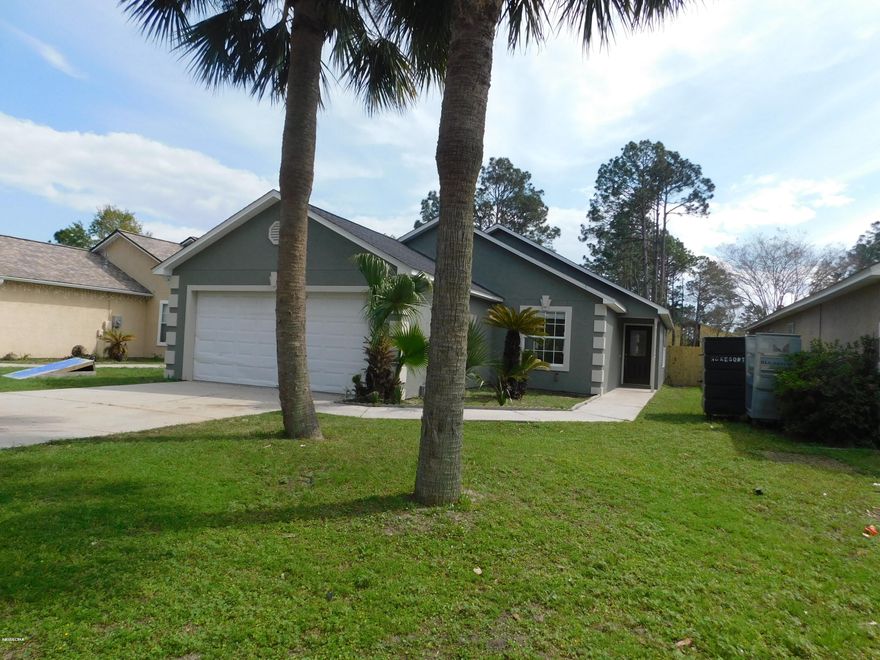 Newly renovated home , freshly painted interior and exterior, remodeled kitchen with White shaker style cabinets and Quartz counter tops as well as  Stainless appliance package. The kitchen has a large dining area . The kitchen opens to the living room with a breakfast bar. Living room has vaulted beam ceiling as well as corner built in bookcase. Sliding doors lead out to the very large covered porch with vaulted ceiling as well. You'll enjoy the privacy fenced back yard. Master bedroom has a private bath as well as a walk in closet,master bedroom has new carpet, the other 2 bedrooms are nice size with carpeted floors and share a hall bath. Leading out to the 2 car garage is the laundry room. Vinyl plank laminate throughout the home except for the bedrooms have new carpet..