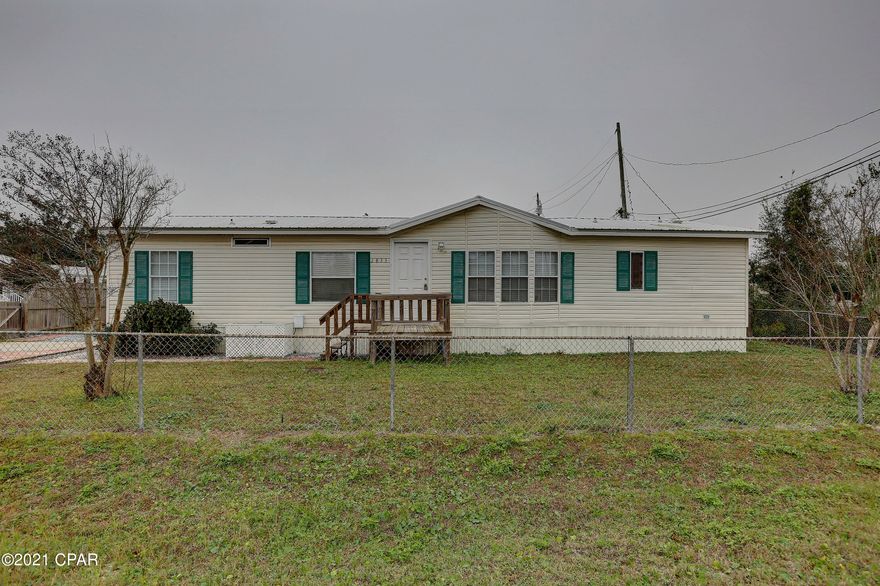 3 bedroom, 2 bath double-wide mobile home centrally located close to schools and shopping. Home features large living room with fireplace, separate dining room and spacious kitchen with lots of storage space. Master suite has French doors leading into Master bathroom that features a large garden tub. Backyard has privacy fence and storage shed. Home has a new roof (2018) and a new deck. House is on city sewer and water. 

All sizes are approximate and should be verified.