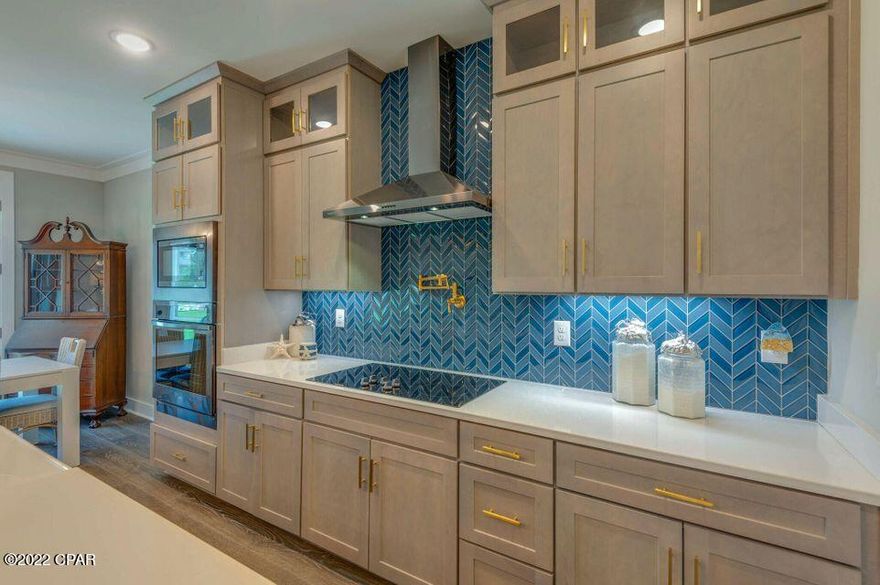 Coastal Home newly constructed on an oversized premium lot with large driveway. 3BR, 2BA built with quailty craftsmanship with many upgrades and designer features throughout. Spacious kitchen includes a large center island, great for entertaining, stainless appliances, custom cabinets with soft-close doors and drawers, Quartz countertops, dramatic counter to ceiling backsplash, and a custom-built walk-in pantry. Two car garage with polished epoxy flooring finish and specialty wall organizing system. The Preserves at Lake Powell is centrally located on the West end of Bay County with quick and easy access to Pier Park, dining, shopping, and outdoor activities such as biking, hiking, kayaking, paddle boarding, and boating.