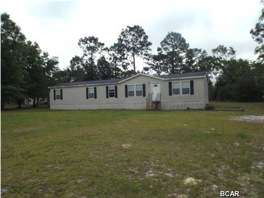 Four bedroom 2 bath manufactured home on an acre lot offered as is. The home boasts large living room, separate dining room and, fireplace. Enjoy a pleasurable quiet life in the country near Econfina Creek and Highway 20. Call for your personal tour today. All sizes are approximate please verify if important.