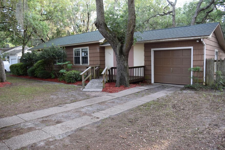 This ranch style home is in the heart of the Cove.  The home has 3 bedrooms, 2 bathrooms, living room with hardwood floors, eat in kitchen, a bonus room and a laundry room. The master bedroom has a bathroom on suite and sliding doors that open  to a deck and the back yard. The shaded yard is fenced with a gate opening to the back alley. In addition to an attached garage, there is also a detached garage/workshop with electricity.