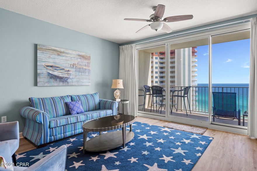 COMPLETELY UPGRADED AND UPDATED. Take in peaceful, elevated water views in this luxurious Shores of Panama Condo. This highly desirable rarely available open concept C Plan offers a spacious living room and master en-suite with direct pool and GULF VIEWS from both, and a private bunk-room that can serve as a second bedroom. Additionally, two full baths make for wonderful ease of living. Enjoy welcoming, beautifully furnished spaces with new LVP flooring, upgraded bath and lighting, New Stainless appliances, and vibrant color scheme. Renovated private bunk room features custom full size bed w/twin bunk on top with newly installed privacy door. Relax by the pool or in the inviting living room or sip a cool drink out on the spacious oversized balcony and gaze at the pool and Gulf beyond. Residents and guests of Shores of Panama enjoy unparalleled resort-style amenities. Turnkey and ready to rent. Shores of Panama is an excellent location on the beach next to Pineapple Willy's and is within walking distance of other restaurants and entertainment. Like thousands of visitors each year, your family will LOVE Shores of Panama.