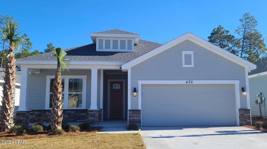 The Sand Dune Carolina elevation floor plan features 1946 sq ft and a 2-car garage. Optional upgrade for a 3rd car available. All interior features have 9 and 10 foot ceilings, tile and carpeted floors. The kitchen showcases granite countertops, a gas stove, microwave, dishwasher, garbage disposal, and recessed lighting. All builds are above hurricane code with 2'x6' exterior wall framing, hurricane tie down rod and anchor system, architectural shingles and higher insulation ratings. The home features a front and back covered porch to entertain and enjoy the beautiful neighborhood. Breakfast Point is just minutes from the beach and shopping. Please visit the model home located at 206 Basin Bayou Drive for more information!