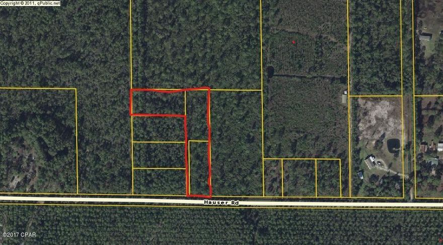 Irregularly shaped 3 lot parcel that totals 3+ acres.Located on Hauser road which is paved. 135 ft of road frontage. 15 minutes to shopping, 25 minutes to Tyndall AFB, boat launch minutes away. Very few small parcels left.