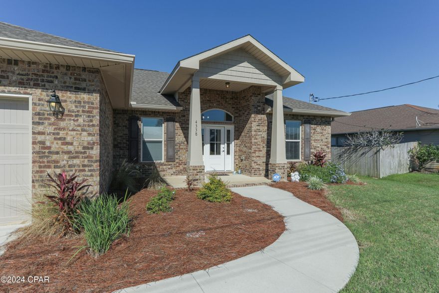 - CURRENTLY UNDER CONTRACT WITH CONTINGENCIES, SELLER WILL STILL CONSIDER BACK UP OFFERS - Welcome to Gulf Breeze and to this home a stunning 4-bedroom, 2-bath all-brick gem, perfect for easy living and entertaining! Completed in 2021, this home is nestled on a quiet dead-end street with low traffic, offering peace and privacy. Step inside to find a split bedroom floor plan featuring an open living space that flows effortlessly into a spacious kitchen with plenty of counter space, ideal for gatherings and meal prep.
The master suite offers a relaxing retreat with a large soaking tub, separate shower, and ample space for unwinding. The French doors off the living area lead to a covered porch where you can enjoy outdoor living year-round, overlooking a fully fenced yard with a Rain Bird Irrigation system front and back, Gutters .
Conveniently located just 3 miles from the Tiger Point commercial area, you'll have quick access to shopping, dining, and medical facilities. Don't miss out on this beautiful, move-in-ready home listed competitively for a quick sale!