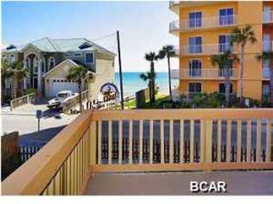 MASSIVE $200,000 PRICE REDUCTION, DOWN TO $399,000 FROM $599,000. SUPER MOTIVATED SELLER, PLEASE SHOW AND BRING OFFER. SEEEPS 16+, RENTAL MACHINE! This property is being sold fully furnished, everything goes! This huge beach house sleeps 16+ and is located right across the street from beach access and has a great beach view from the large upstairs deck. What makes this house very special is that it has 3 kitchens and 3 separate living room areas which makes it great for multiple families. Plus, it has an outdoor bar! From the minute you walk in the door you'll know this house is really special. The owners remodeled it so that everything is fresh. When you come in the front entrance you are welcomed by a roomy seating area with a big screen TV that offers the XFINITY package of
