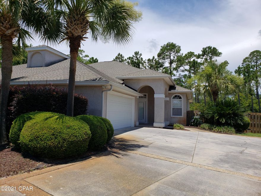 Here is a unique opportunity to purchase a home in one of Panama City Beach's most desirable Gated, Bay Front Communities with a Deep-Water Marina with boat slips and direct access to the Intracoastal waterway!  If you are a boater, fisherman or just love the water, you have found your spot!  If you are looking for a nice home in a quiet gated community, you have found your home!  A prompt purchase will avoid the bidding wars!  This attached 3 BR - 2 BA home with side entrance garage and large fenced back yard, situated on a cul-de-sac street, provides the perfect escape from the busy beach activities.  It is a low maintenance home and has been well taken of by the owners.  To include a NEW ROOF in 2019, NEW HVAC system and NEW APPLIANCES ++ ... see the attached UPDATES LIST for specifics. The home boasts 10' ceilings, crown molding throughout the living areas, fireplace, breakfast bar and large eat-in kitchen area, wood cabinets and solid surface counter tops.  The master bedroom opens into the large master bathroom with has both a walk-in shower, jacuzzi garden tub and double vanities with custom marble tops.  Additionally, there is a large walk-in closet with custom shelving.  The back yard has ample room to add a pool if so desired and, will accommodate temporary boat parking.  All dimensions, square footage, age and measurements are approximate and if important should be verified prior to purchase.