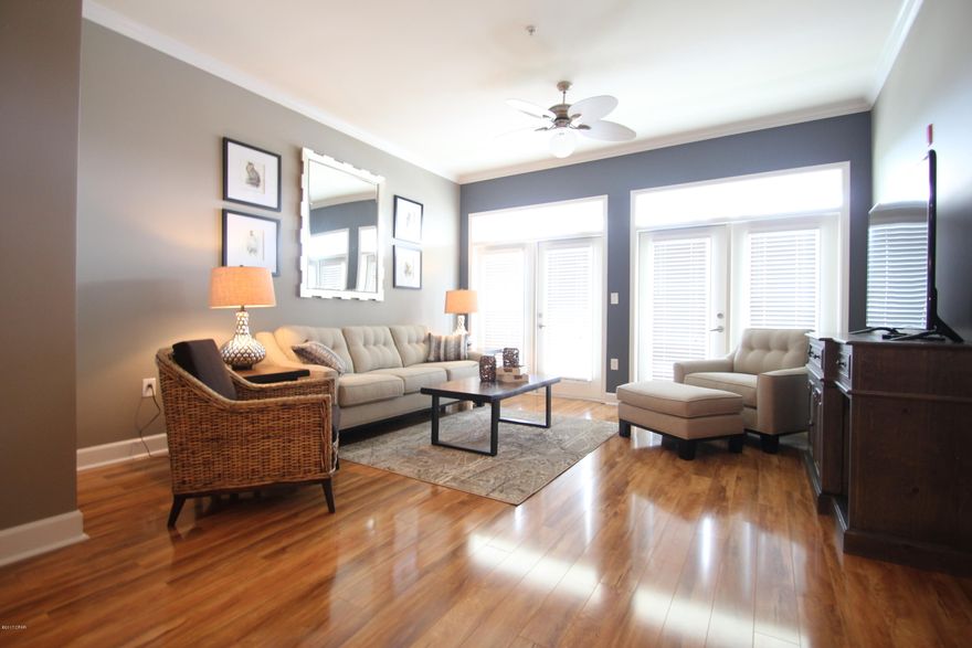 Top floor, all one level, Great Island Reserve condo has a private location. Faces South 5 Star Resort living with 1 acre pool, fitness center, indoor basketball court, and theater with no vacation renters allowed keeps Island Reserve the most sought after community in PCB. This 2 bedroom 2.5 bath condo is located in one of nicest gated communities for condo living 1 mi to the Gulf of Mexico where you can walk in the sugar white sands along the World's Most Beautiful Beaches. There is beautiful wood flooring in the open concept living and dining room areas which flows into the kitchen. Granite countertops and a large island make this kitchen perfect for entertaining friends and family. These luxury 2 Bedroom condos don't last long on the market, LOW ASSOCIATION DUES & ELEVATORS