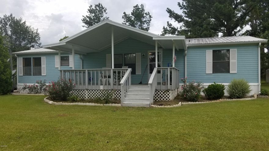 Great Doublewide MH on Willow Pond. 3 Bedroom 2 Bath, with 1404 sq ft. Enjoy summer nights on the front porch. Covered back porch, storage building.