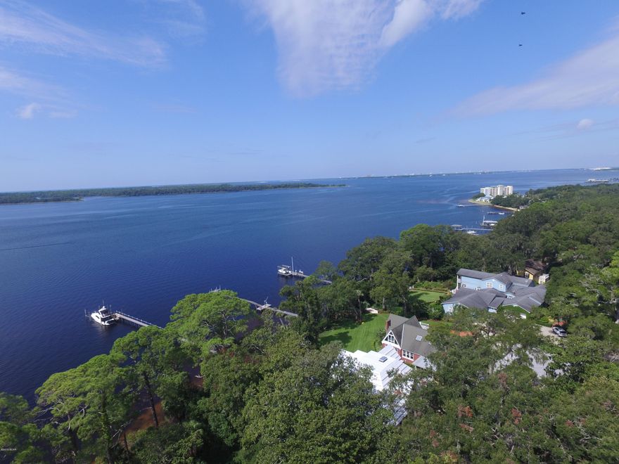 Only 2 Bay Front, Bunker's Cove lots on St. Andrews Bay with a view of the Pass. The lot two doors down sold for 500k! Park your boat behind your house, The ''Cove'' offers Public and Private Schools, located near Downtown and the Panama City Marina, convenient to everything and just down the street from the St. Andrews Yacht Club. All City Utilities are available to this site. Check out the photos for the aerial shots of the spectacular waterfront as well as the oaks that adorn the streets in the historic Cove area. R1 Zoning, setbacks are, Front-20', Rear-30', Sides-7'. Drive or Boat on over today!
