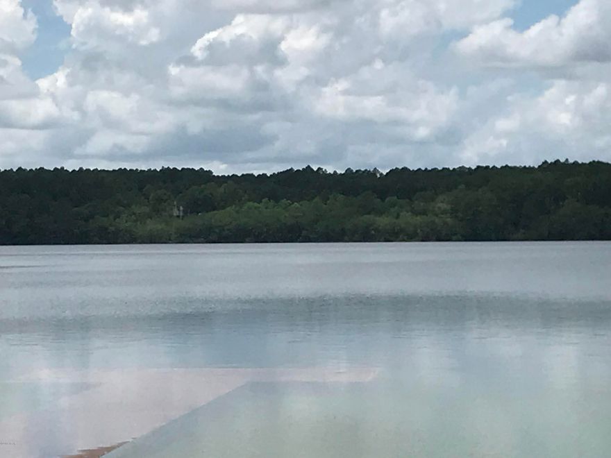 Excellent lot on Lake McCormick.  Approx 297' water frontage this would make a wonderful weekend getaway or possible

home site. This lot is part of Compass Lake in the Hills Subd.  Great amenities come with the property including, pool, lodge with restaurant, horse stalls, picnic area's, cabin rentals and more.  Only about 40 minutes to Panama City Fl and 50 min to the beach.