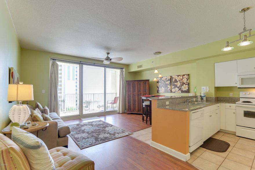 Located in the very popular Shores of Panama development, this 1Bed/2Bath+Bunk has it all including a private parking space on the same floor!! This fully furnished and rental ready property has been professionally decorated, custom painted and has upgrades galore. Features Include: 1 bedroom and a bunk Room, 2 full baths, hard surface flooring through-out, gulf front living room, 9ft ceilings, granite countertops & breakfast bar. Large Terrace offers the perfect view - you not only see the most beautiful beach in the world, you get the most beautiful lagoon pool in all of Panama City Beach! The Shores of Panama offers resort style amenities including 13,966 SF gulf side pool and hot tub, large heated indoor pool & hot tub, tropical landscaping, bridges, fountains, video bank, media room, health and fitness center, spa, sauna, massage therapy and steam room, 2 tiki bars serving lunch and dinner, Kids Club activity program, meeting spaces, covered on-site parking deck and on-site reservation desk. Terrific location with quick access in all directions to restaurants, entertainment, Pier Park, shopping, gold courses, and only 20min away from the International airport. Makes this your new home away from home! Close now and just in time for the high $ rental season!