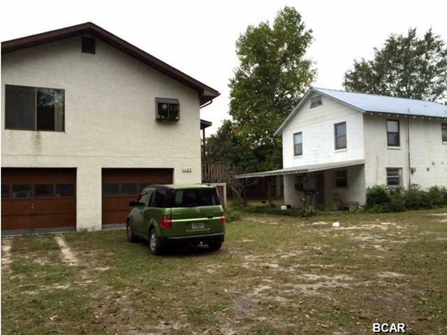 ONE OF A KIND WELL CARED FOR PROPERTY! THIS PARCEL HAS ENDLESS POSSIBILITIES. THERE ARE CURRENTLY 2 HOMES LOCATED ON THE LOT. THE MAIN HOME HAS 2/1 UPSTAIRS AND 1/1 DOWN. THE ADJACENT PROPERTY ARE 1/1 UP AND 1/1 DOWN. THE MAIN HOME OFFERS A LARGE GALLEY KITCHEN WITH BREAKFAST BAR, SPACIOUS LIVING ROOM AND 2 BEDROOMS WITH JACK AND JILL BATH. ALMOST NO CARPET ON THIS LEVEL. THE DOWNSTAIRS UNIT IS SPACIOUS WITH ITS OWN BATHROOM AND SEPARATE ENTRANCE. THE ADJACENT HOUSE DOWNSTAIRS UNIT HAS A LARGE LIVING AREA,KITCHEN AND SPACIOUS BATH. THE UPSTAIRS UNIT OFFERS BEAUTIFUL HARDWOOD FLOORS IN THE LIVING ROOM,NICE KITCHEN AN OFFERS AN OVERSIZED BEDROOM THAT CAN EASILY BE MADE IN TO TWO. THE MAIN HOUSE OFFERS DOUBLE CAR GARAGE. THIS PROPERTY IS CURRENTLY ZONED GC2 AND HAS COMMERCIAL OPTIONS