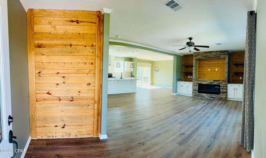 Welcome to this BRAND NEW, never lived in spacious 3-bedroom, 2-bath home offering 1,920 square feet of comfortable living space on a large lot convenient to all the action Panama City has to offer. From the moment you arrive, the welcoming stacked stone entry adds charm and curb appeal.

Inside, the home features a thoughtfully designed open concept living area centered around a beautiful stacked stone entertainment wall with wood accent, floating shelves, and an electric fireplace, creating a warm and inviting focal point for relaxing or entertaining.

The large kitchen and open living space provide plenty of room for gatherings, while the generous lot offers endless possibilities--add a pool, build a storage building, or create your dream outdoor space.

The primary suite offers a large soaker tub, tiled walk-in shower, and a seperate master closet. Each additional bedroom also features its own walk-in closet, providing ample storage throughout the home.

As an added bonus, the seller is offering a $2,000 allowance toward the purchase of a refrigerator, giving buyers the opportunity to choose the model that best suits their needs.

Don't miss the chance to own this spacious home with desirable features and room to grow in Panama City!
