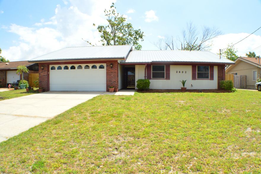 CURRENTLY UNDER CONTRACT, SELLER ACCEPTING BACKUP OFFERS.  Immaculate 3BR/2BA home in the Point Royal (old Bay Point) area of Panama City Beach. This home has a 3 year old metal roof, freshly painted interior, brand new privacy fence, and a two car garage. The home features a spacious interior with a large great room with fireplace, low maintenance flooring throughout, separate dining area just off the kitchen, the kitchen has a breakfast bar and a pantry, and the master bedroom has a walk-in closet.  This is a home you can easily move right into!  You're just around the corner from shopping, the beach and Navy base are both 5 minutes away, and its a quiet and family-friendly neighborhood.  All info is approx. and must be verified by Buyers if important.