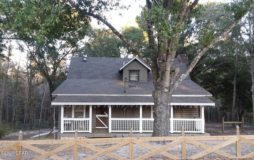 Beautiful rustic 2-story pine log home nestled among the oak trees offering a 2018 roof, wood doors, stone gas fireplace, wood floors (no carpet) & wood cabinets. The 19.8 acre farm (2016 survey) is fenced and cross-fenced with 3 animal paddocks, multiple gates, a 2-story barn w/bath (needs work), 2-car log carport, plus front & back porches. The master bedroom and bath is on the main level with the other 2 bedrooms and 3/4 bath being the only areas upstairs. Home even has a basement for storage with dehumidifier and sump pump under the concrete floor. The acreage behind the home has been left in its natural state with low lying areas that are wet (appx 8-9 acres). Beautiful 2-1/2+/- acre high & dry area accessed by 4-wheeler trail.