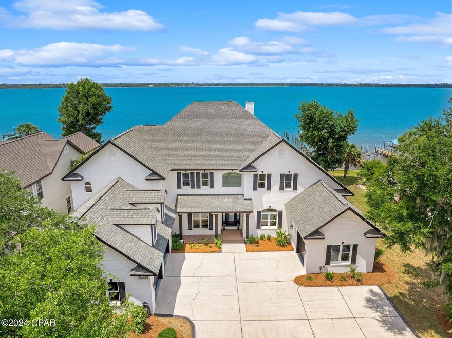 Discover the epitome of waterfront elegance in this luxurious two-story residence nestled within the prestigious Panama Country Club in Lynn Haven, Florida. Boasting an impressive 5,502 square feet of meticulously designed living space, this exquisite home offers a seamless blend of sophistication and relaxation. From the moment you arrive, you'll be captivated by the stunning panoramic views of the water, setting the stage for a lifestyle of unparalleled luxury.

Indulge in the ultimate waterfront experience with your very own private deep water dock featuring a convenient boat lift, allowing for effortless access to the serene waters of St. Andrews Bay and direct Gulf of Mexico access. After a day of boating and exploration, retreat to your own personal oasis and unwind in the inground spa, enveloped by the tranquil sounds of the waterfront. Whether you're hosting gatherings in the spacious living areas, enjoying al fresco dining on the patio, or simply soaking in the breathtaking views from the primary suite's private balcony, every aspect of this magnificent home is designed to elevate your waterfront living experience to new heights. Don't miss this rare opportunity to own a piece of paradise in the Panama Country Club.   
Contact your favorite agent today!