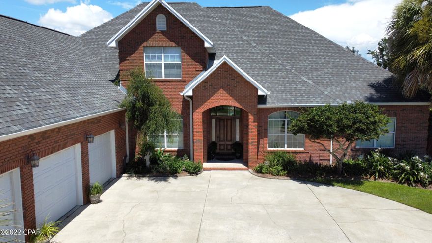 This beautiful custom-built home sits on a 200 foot canal front lot in the exclusive Kings Point neighborhood.  It features a cooks kitchen with large walk-in pantry, a built-in security system and a large lanai that overlooks an 18x36 ft saltwater pool. The canal dock boasts a covered boat lift.  You'll also love the separate brick out-building which houses a workout room (exercise equipment included) and a storage room for boat/lawn equipment and a drop down ladder for overhead storage. An added bonus is NO HOA and the BEST neighbors you could ask for.