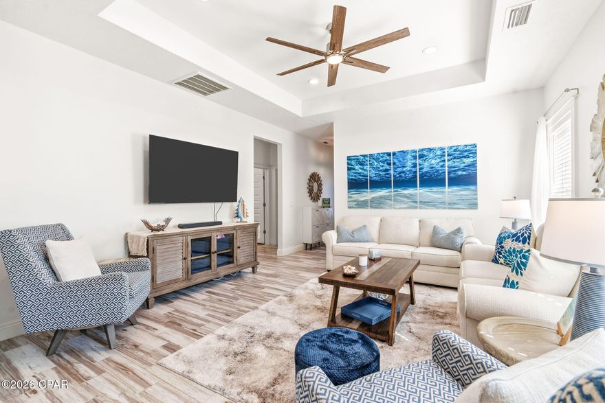 Fully furnished - the ultimate turnkey beach home! This is where comfort and coastal lifestyle
come together in one incredible package. Built in 2016, this beautifully maintained Craftsman-
style home is truly move-in ready.
Step inside to an open, light-filled layout featuring 9' ceilings with 10' tray ceilings and tile
flooring throughout - perfect for low maintenance living. The home has been thoughtfully
refreshed and updated creating a clean and contemporary feel. The kitchen features like-new
appliances (Nov 2024), updated countertops, sink, faucet, disposal and a reverse osmosis water
faucet for premium everyday living (all in 2025). The pantry space has been updated with 6 ft
wood shelves to maximize space. Enjoy outdoor at its best with a spacious 10x20 screened-in
porch (2025) and BBQ area, plus a fenced yard (2025), and irrigation system - ideal for relaxing
or entertaining. A north-facing orientation minimizes direct sun exposure and keeps the home
cooler - resulting in lower energy costs year-round.
Built for peace of mind, this home includes hurricane-rated windows and doors, aluminum
storm covers, a NEW hot water heater, transferable home warranty and termite bond.
Tucked away in a golf cart friendly neighborhood with convenient access to Frank Brown
Recreational Complex just 5 houses away. Enjoy being conveniently located less than 1 mile to
the beach and all that Pier Park offers for shopping, dining, and entertainment. Cruise over to 30A in 20 minutes!
No HOA and with no short-term rentals allowed, offering a quieter, more stable neighborhood
with longer-term neighbors and no constant vacation turnover.
Whether you are looking for a primary residence, second home or long-term investment, this
property delivers unmatched value, lifestyle and convenience - all in one! 
📍 Schedule your showing today and start living the beach life from day one!