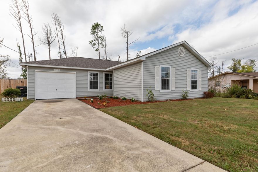 Completely upgraded, contemporary style home on a large lot in the heart of Lynn Haven! New dimensional shingle roof; new plank tile in the kitchen, dining room, halls and bathrooms; all new cabinets, appliances, sinks, toilets, AC unit and water heater! The countertops are all granite, the colors are all neutral, including the new carpet in  the bedrooms and living room. The master bedroom has trey ceilings. Even the garage floor is coated in sparkly rustoleum! Exterior doors are new as well as all interior light fixtures! The huge back yard is privacy fenced. This one is ready for an owner! Termite treatment policy conveys to new owner as well.