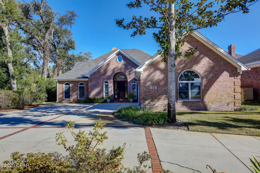 Nestled in the historic Cove. This elegant home will lure you in with its charm. This cozy home is  located on Watson Bayou and offers a private dock with a boatlift, and only minutes away from Gulf access. The home has views of the water, and beautiful land scape from every room. The home  has an open floor plan, that provides a large open kitchen. The guest bedroom offers and sitting room and the home also has a sewing/craft room with so much storage. The master bathroom offers a hot tub, and so much more. This home is a must see.