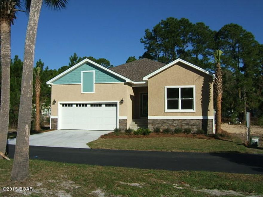 Amazing new home under construction on canal on Panama City Beach. Located 1/2 mile from Hathaway Bridge, this home near beach activities, shopping, work, and you can hop in a boat in your backyard and be at the bridge in 5 minutes. Granite counter tops, 9' ceilings, gated community. The amazing feature that saves you $ year after year is the elevation above flood zone and the hip roof design. Stone will dress the 1/2 front of the home with skim stucco to the soffit. Some options can still be selected....so make an appointment today!This is an artist rendering and colors, dimensions, and features are not necessarily as plans. Please refer to Drawings for accurate dimensions.
