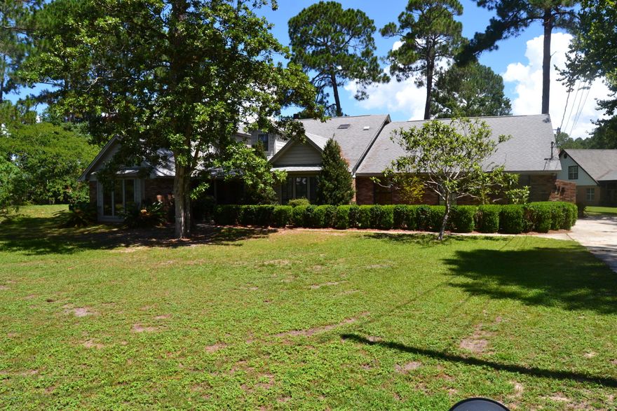 LOCATION, LOCATION, LOCATION. This beautifully maintained 4 bedroom, 3 bath home is centrally located to EVERYTHING on a 3/4 acre wooded lot. Living here, you have access to the best restaurants, shopping, schools and close to all of the military installments.  This home has been maintained like a new home with a newer roof, granite counter tops, new carpet, 2 AC units, 2 water heaters and an upgraded appliance package. The floor plan is set up with a HUGE master suite featuring hardwood floors and an exterior access to the inground pool.  In addition to the master there are 3 other bedrooms split from the master with one bedroom having a full bath and access to the pool, perfect for a guest room.  The kitchen has solid wood cabinets and granite counter tops making it a gourmet chefs dream A two sided firplace separates the two living rooms/family rooms. The home also features an oversized garage with a workshop area and a covered front porch.  A backup generator is for peace of mind.  The inground pool has a newer liner as well as a Polaris cleaning system.  This home overall is as good as a brand new home and is move in condition.  Do not drive by this without looking!  Call your Realtor today.  Ask your Realtor for a copy of "List of Features" from Documents section in MLS.