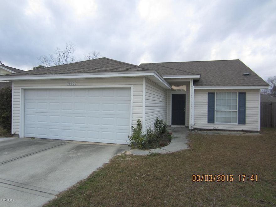 Beautifully renovated 3 bedroom 2 bath home with attached 2 car garage has easy to maintain vinyl siding & is located between Hwy 231 and Hwy 98, just off East Ave., giving convenient access to Hwy 98 & Hwy 231 for traveling to the Panama City Mall, Panama City Beach, shopping, restaurants, etc. McQuaig Construction built this home in 2005 and the current owner has updated and renovated very tastefully. Lovely open living area with exotic looking Maple style hardwood flooring with premium underlayment (durable with low maintenance) and a breakfast bar between the kitchen and living/dining area. The kitchen boast with new stainless appliances & upgraded Uba Tuba Grantie counter tops that match the bathrooms. There is a covered back patio off the living room that overlooks the backyard.  The 2 car garage allows entry into the home via the laundry room, perfect for boots, shoes and jackets to come off.  The HVAC has a new programmable thermostat that saves money "for sure", as per the owner, it was tested and passed as compared to the summer before it was installed!
