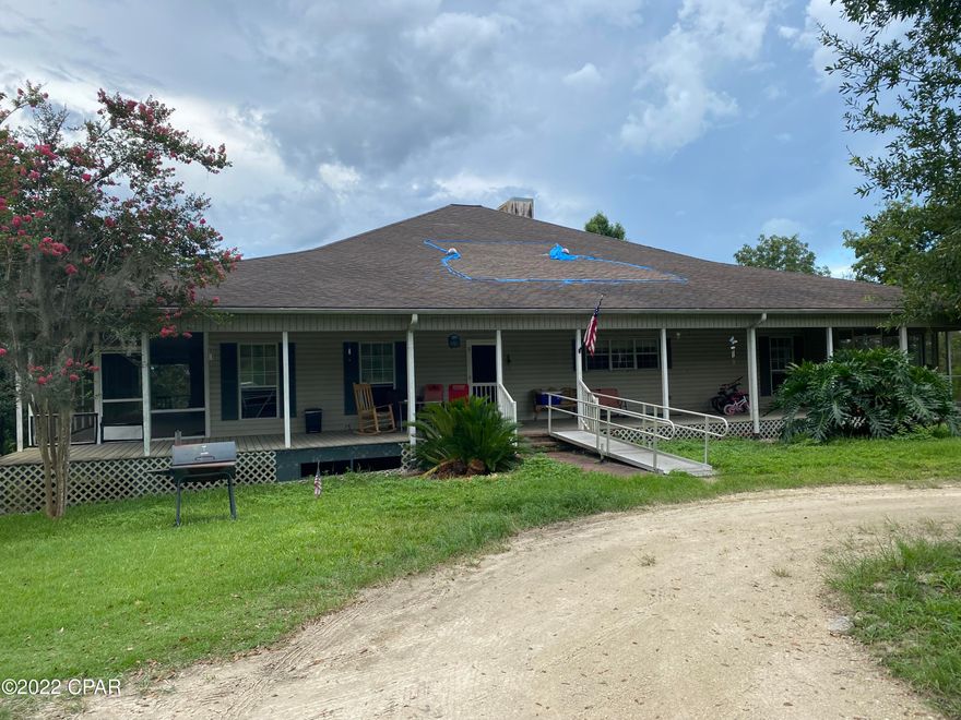 PRICE REDUCTION! Investors! Investors! SELLER MOTIVATED MAKE AN OFFER! MUST BE CASH. A Diamond in the rough! Spacious Contemporary 5 Bedroom/5 Bath home sits on a bluff with a great view of the Chipola River. The wrap around porch and large Inground pool is reason enough but this home also boasts a private Boat slip Home has a Huge Great room and Stone Fireplace, 3 sets of French doors that open onto the fabulous screened porch overlooking the River. Built in cabinetry in the great room provides plenty of storage. The Master suite also has a Fireplace! The 2+ acre tract has 213 ft on the river with boat launch right down the road. Come take a look today! Buyer and Buyers agent to verify all dimensions and anything deemed important.