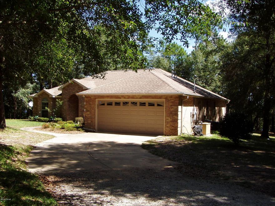 WATERFRONT-Beautiful,3br/2ba,1692sf quality built brick home on 4.5 acres w/281'on the water in a park like private setting. Foyer entry.Great room has 10'ceilings,gas fireplace,hardwood floors,built in entertainment center and double doors  that open onto screened back porch. Kitchen has solid surface countertops, beautiful cabinets, tiled backsplash, breakfast area & a pantry. There's also surround sound, a security system, central vac & full house generator.Brand NEW ROOF too! Termite Bond too..Outside:detached single garage/shop w/covered 10x20 porch,24x36 pole barn,deck overlooking the water, 40'dock to enjoy the 600 acre lake; fishing,canoeing,boating n paddle boarding, electronic gated entrance w/remote, keypad & automatic sensor.Just come see it. It's peaceful & quiet.