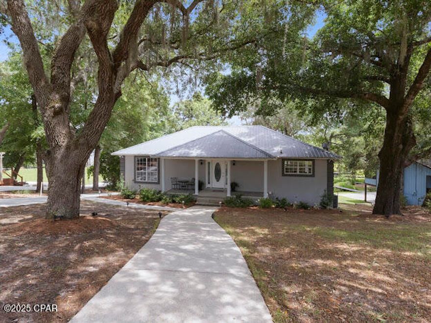 CURRENTLY UNDER CONTRACT, SELLER WILL CONSIDER BACK UP OFFERS,,,LUXURIOUS Lakefront Living on Beautiful Gap Lake!
This stunning custom-built home offers 3 bedrooms, 2 baths, and an oversized heated and cooled 2-car garage that can accommodate two full sized trucks and a golf cart.  Thoughtfully designed with granite countertops throughout, tile flooring in the main areas, luxury vinyl plank in the bedrooms, a charming spiral staircase, and a cozy fireplace, this home blends comfort with elegance.

The community is amazing, enjoy golf cart rides as well as ATV excursions. 
Perfect for entertaining friends and family, this property offers beauty from every angle and endless recreational possibilities. Enjoy your own private dock and jet ski dock for year-round lake activities. Located just 1.3 miles from Sunny Hills Golf Course (an easy golf cart ride) and under 2 miles from a newly renovated, well-maintained public boat ramp. On this huge lake motorized boats are allowed so boating out your back door is a great convenience. You're only 15 minutes from Chipley and 30 minutes from Lynn Haven, an ideal balance of convenience and peaceful seclusion. Washington County has very reasonable taxes and lower insurance costs compared to other areas. 

The spacious master suite features a breathtaking picture window, offering panoramic lake views right from your bed. The kitchen is a true delight, providing serene views of the water that make daily routines feel like a retreat. As evening falls, relax to the soothing sights and sounds of nature, there's no better way to unwind.

Being at home here feels like a permanent stay at your favorite vacation resort. Whether you're looking for a forever home, a private getaway, or a high-performing Airbnb investment, this one checks all the boxes. Quality craftsmanship, tranquility, and lakefront living at its finest. HOME COMES FULLY FURNISHED!
All measurements are approximate and should be verified by buyer.

Call today to schedule your private tour!