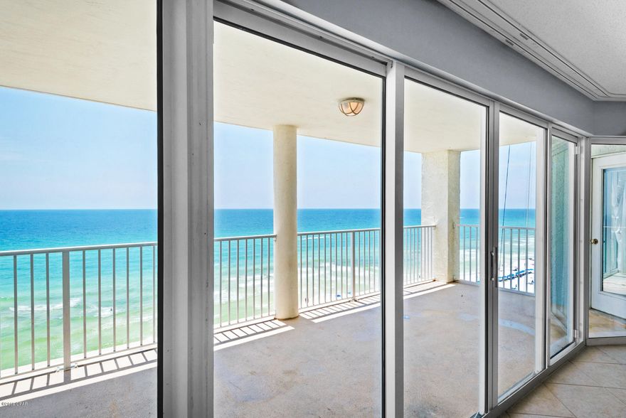 CURRENTLY UNDER CONTRACT, SELLER ACCEPTING BACKUP OFFERS - You can't beat the GULF VIEWS with this floor plan! This highly coveted 3 bedroom 3 bath corner unit at Long Beach offers what everyone dreams about, those gorgeous gulf views from the moment you walk in the living room, the kitchen and floor to ceiling gulf views from both gulf front bedrooms offering balcony access from both! Owner's studio suite offers a small private balcony and peek of the gulf too! NO CARPET in this unit that would make a great vacation rental or beach getaway as it has so much flexibility with the owner's suite with kitchenette.  Seller had interiors freshly painted with a contemporary gray and brand new modern ceiling fans with light installed in living room. Both AC's fairly new,